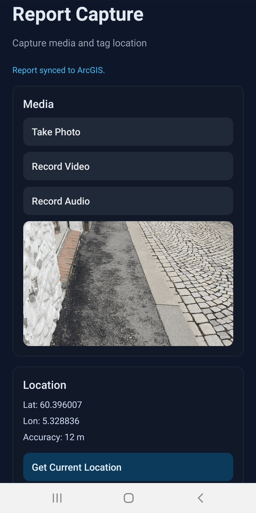 Stratilyze mobile report capture screen with media capture and location fields.